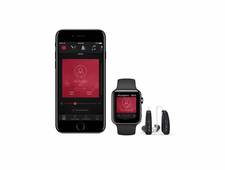 A photo of a smartphone and smart watch open to the ReSound Smart 3D app next to a pair of hearing devices