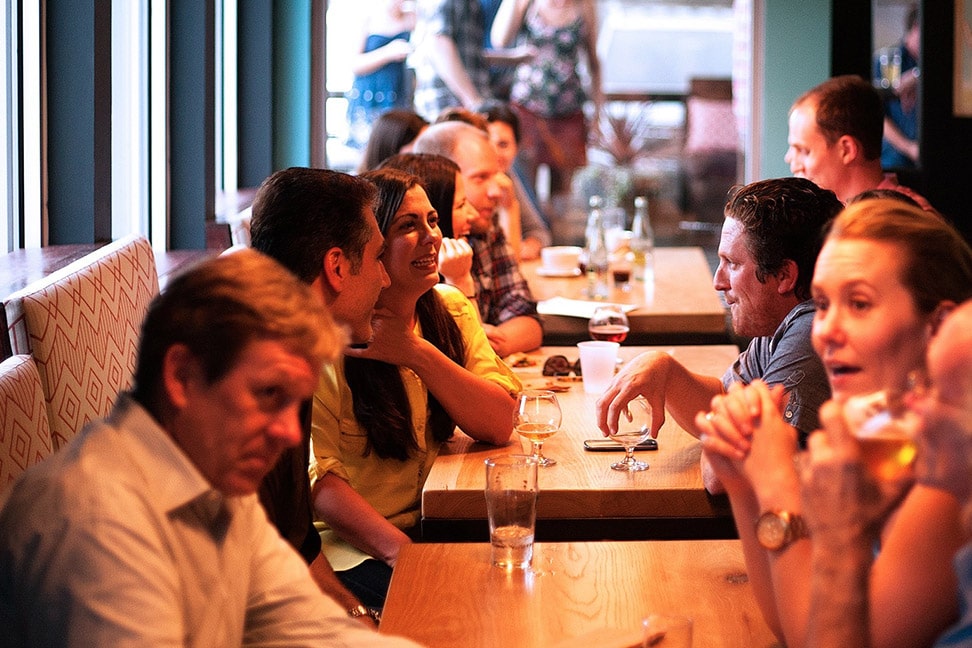 Photo of lines of people facing each other at a restaurant