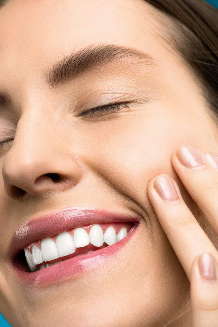 Close-up of a woman smiling.