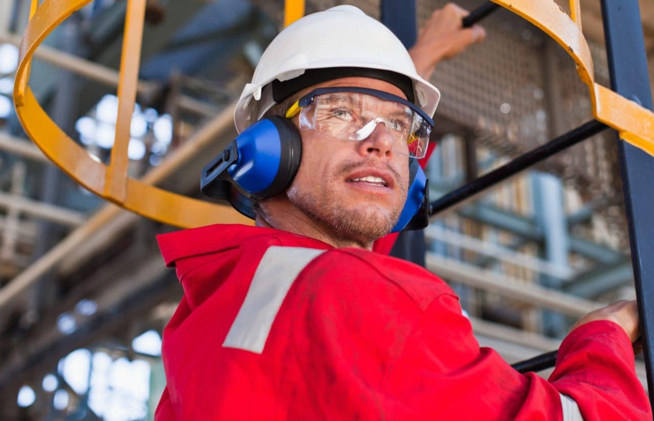 Man wearing hearing protection outside.