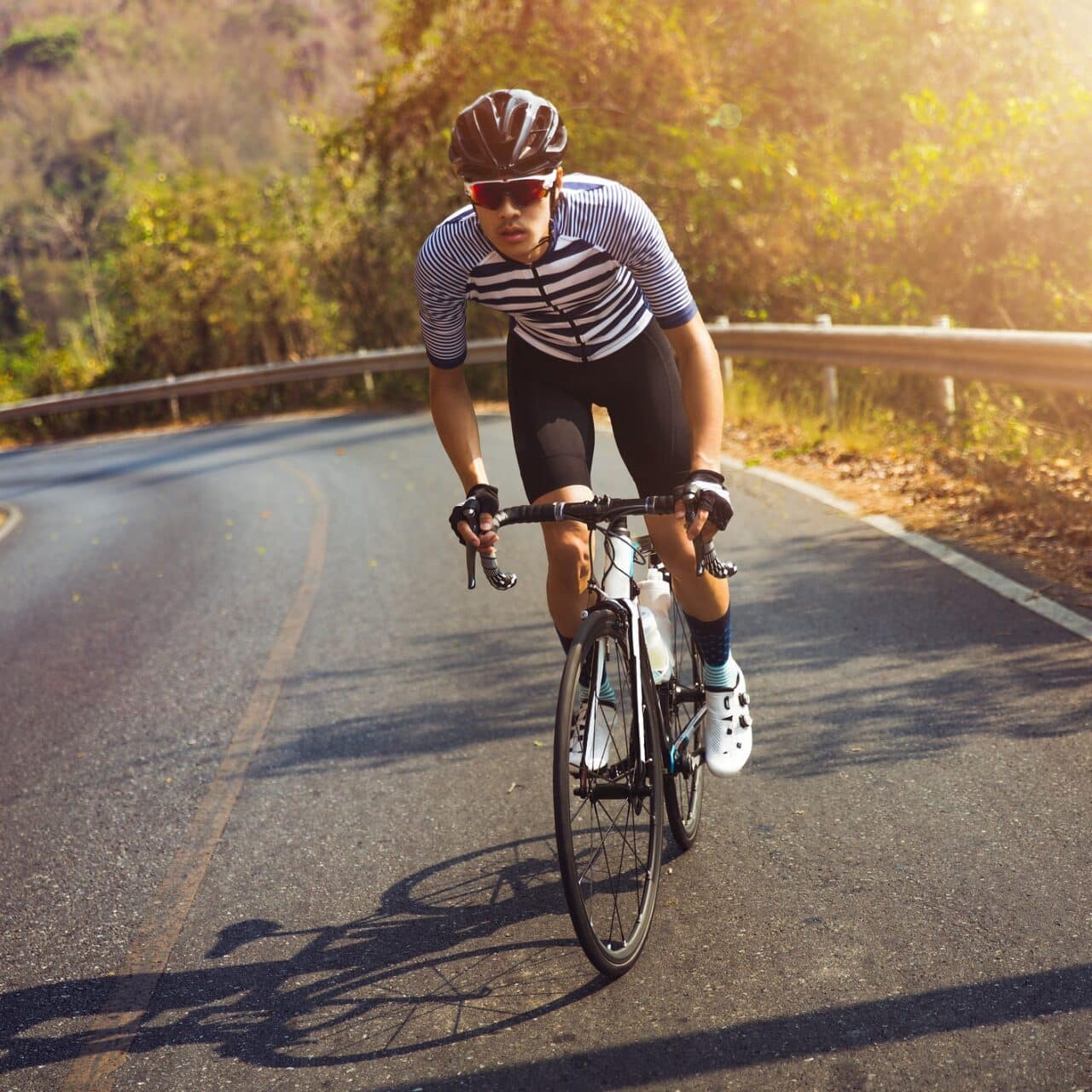 Cyclist biking up a steep hill